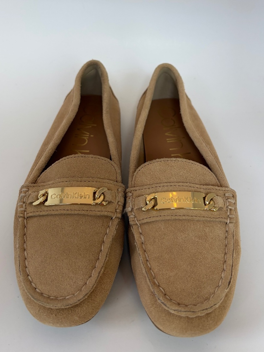 Calvin Klein Lunasi Moccasins in a Tan Suede with gold-tone logo bar, Size 6